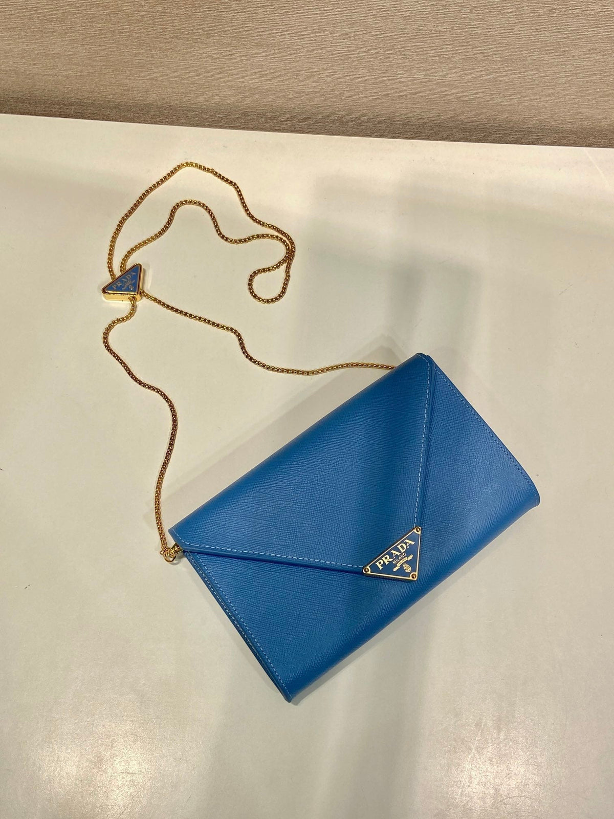 PRA Cross pattern envelope bag blue leather 341158
