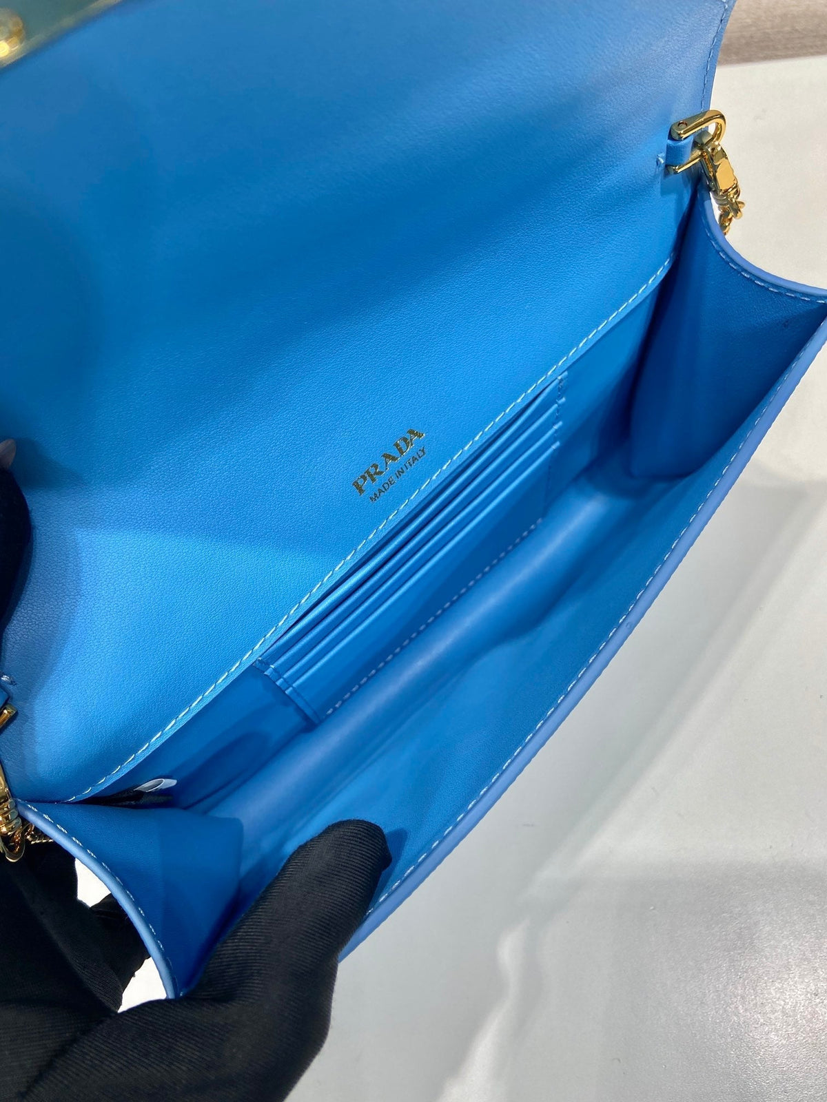 PRA Cross pattern envelope bag blue leather 341158